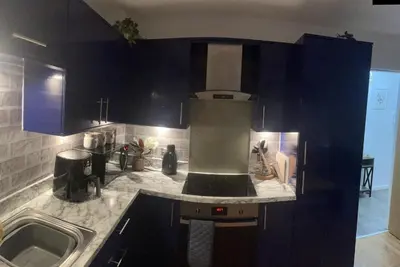 a kitchen with a stove and a sink at THE PAISLEY PENTHOUSE - ABBEY VIEW in Paisley