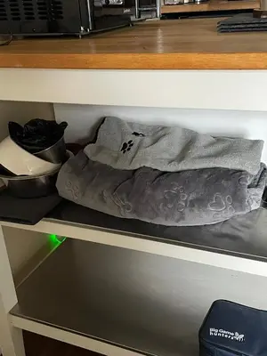 a towel is sitting on a shelf in a kitchen at An Cuilidh in Port Bannatyne