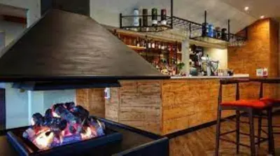 a kitchen with a bar with a large stove at Gulls Island in Morenish