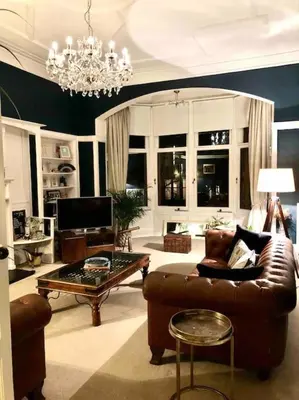 a living room with a couch and a coffee table at Spacious 3 bed flat in the heart of the west end. in Glasgow
