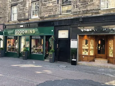 a couple of store fronts on a street at charm & character on historic Rose Street in Edinburgh