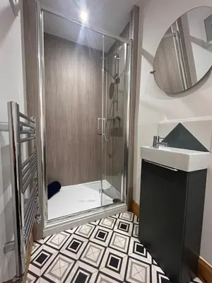 a bathroom with a shower and a sink at Glenshee Annexe, Oban. in Oban
