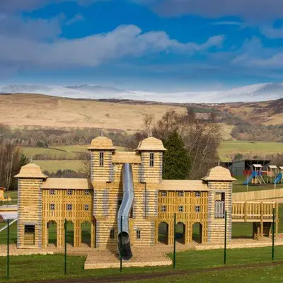 a large building with a statue in front of it at Crieff Hydro Self Catering in Crieff