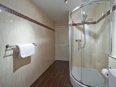 a bathroom with a shower and a glass shower stall at Home Farm Cottages, Glendaruel, Argyll. Scotland in Clachan of Glendaruel