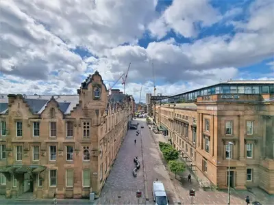 a view of a street in a city with buildings at Stunning One bed with parking in City Centre in Glasgow