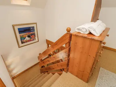 a staircase with two towels on top of it at The Coach House in Oban