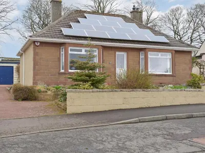 a house with solar panels on the roof at The Shieling in Biggar