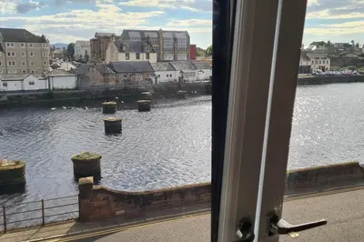 a view of a body of water from a window at Stunning Refurbished 1 Bedroom, Harbour Apartment. in Ayr
