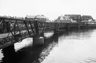 a black and white photo of a bridge over a river at Stunning Refurbished 1 Bedroom, Harbour Apartment. in Ayr