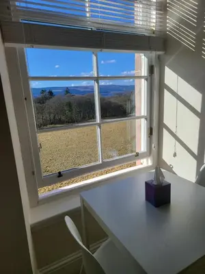 a window in a room with a desk and a view at Langhouse Castle Bed and Breakfast in Inverkip
