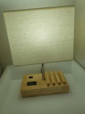 a wooden cutting board sitting on top of a wall at The Creek-Stone Den in Oban