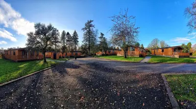 an empty road in front of some houses at Skyline Lodge Loch Lomond Castle Lodges in Balloch