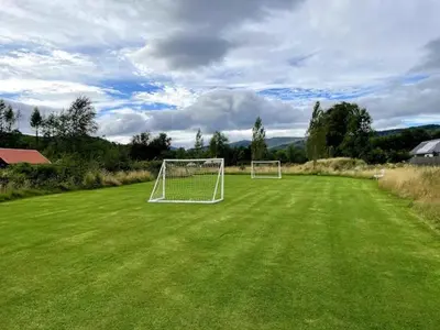 a soccer field with two soccer goals on it at The Bothy in Stirling