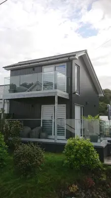 a house with large windows on the side of it at Sea Breezes in Oban