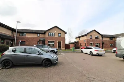 a group of cars parked in a parking lot at Signature - Moore View in Hamilton