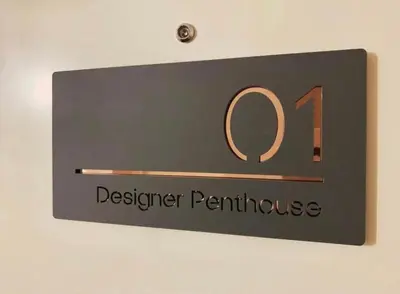 a sign that reads denser perth house on a wall at Designer Penthouse with Riverviews - G1 Glasgow City Centre, 3 Bedrooms, 2 Bathrooms, 1 Living room / Kitchen. Full Floor, Wrap Around Terrace, Panoramic Views, Off Central Station / Buchanan Street in Glasgow