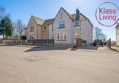 a house on a street with the words kiss living on it at Coats Street Apartment by Klass Living Coatbridge in Coatbridge
