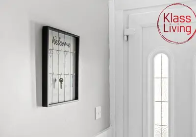 a picture hanging on a wall in a room at Coats Street Apartment by Klass Living Coatbridge in Coatbridge