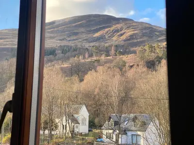 a view of a mountain from a window at Eakie House Apartments - Kinlochleven in Kinlochleven