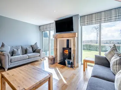 a living room with a couch and a fireplace at Speed The Plough- Uk43631 in Grange