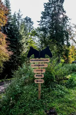 a sign with a horse on top of it at Glamping Pod 2 Magical Craigengillan Estate in Dalmellington