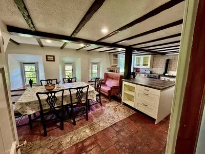 a kitchen and dining room with a table and chairs at East Cottage at Powis House Estate in Stirling