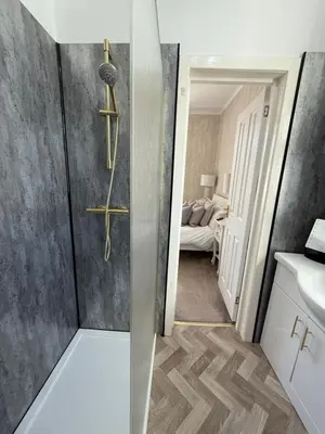 a bathroom with a shower and a sink at Kenavara House in Oban