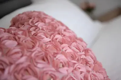 a pink cake with pink frosting on it at Lomond View in Langbank