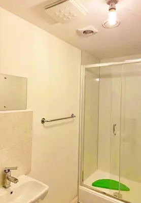 a bathroom with a shower and a sink at 3 bed house with parking near airport in Edinburgh